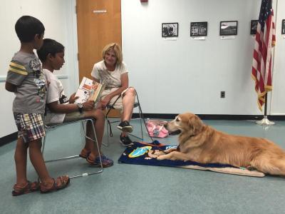 Kids Reading to a Dog